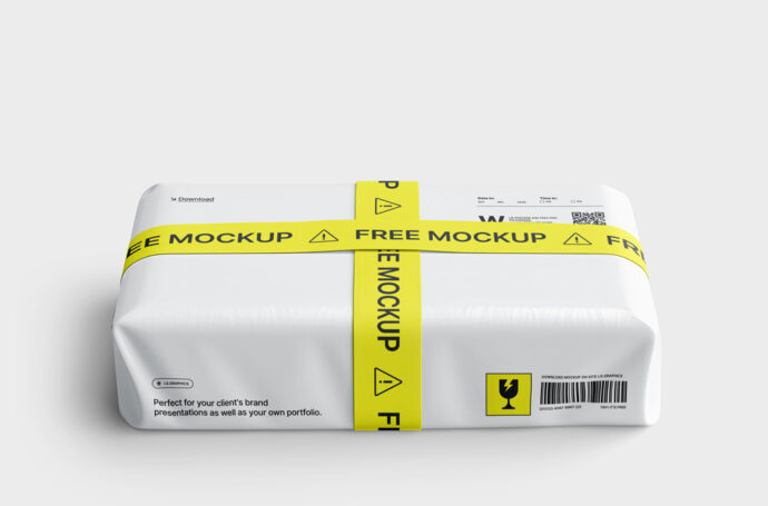 Pacote branco envolto por fita adesiva amarela com a inscrição 'Free Mockup' em preto.